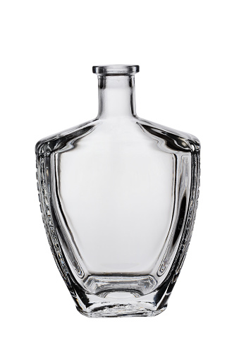 Open empty glass bottle for brandy or cognac, unusual shape. Isolated on a white background