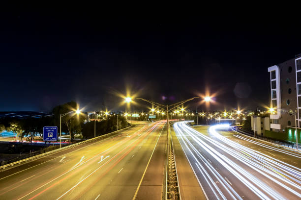 istock Traffic lights on city road during night in Perth, WA Australia 1213224531