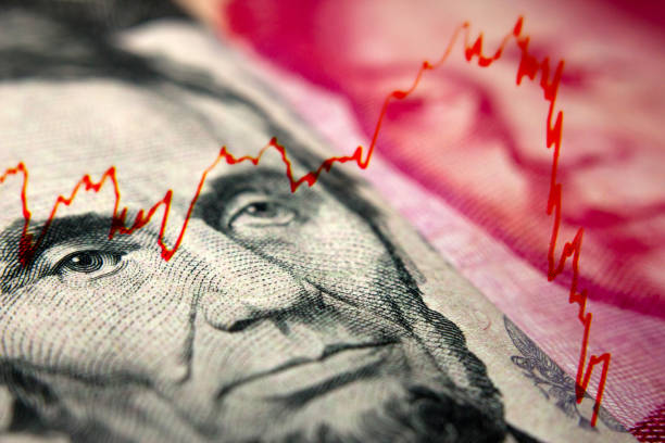 istock Dollar and yuan Chinese banknote 1213225785
