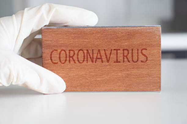 Coronavirus word at wooden block. Coronavirus text.