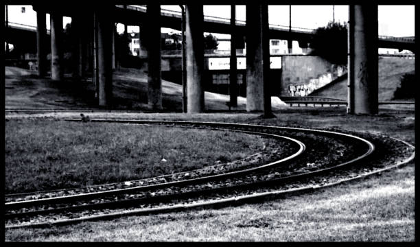 istock tram tracks loop bend black and white viaduct construction poles 1213226291
