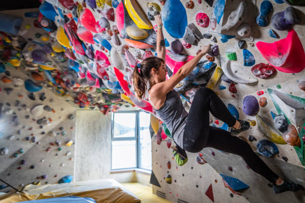 istock Woman climbing on climbing wall 1213227111