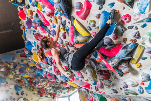 istock Woman climbing on climbing wall 1213227128