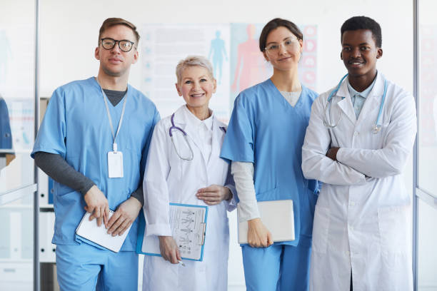 istock Multi-Ethnic Group of Smiling Doctors in Clinic 1213228248