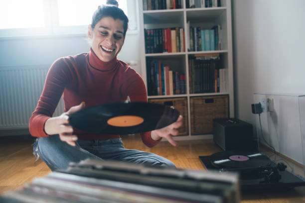istock Hipster girl enjoys vinyl records 1213228774