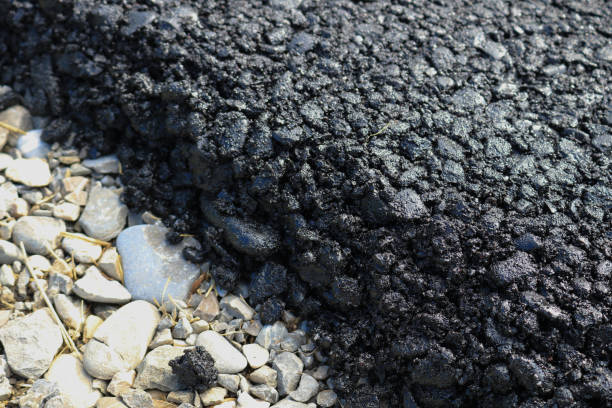 istock New layer of asphalt road under construction  with support from the European Union structural funds. 1213229959