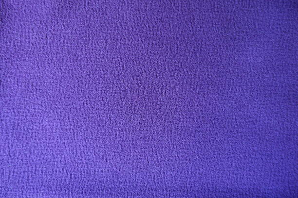 istock Surface of purple polyester fabric directly from above 1213230975
