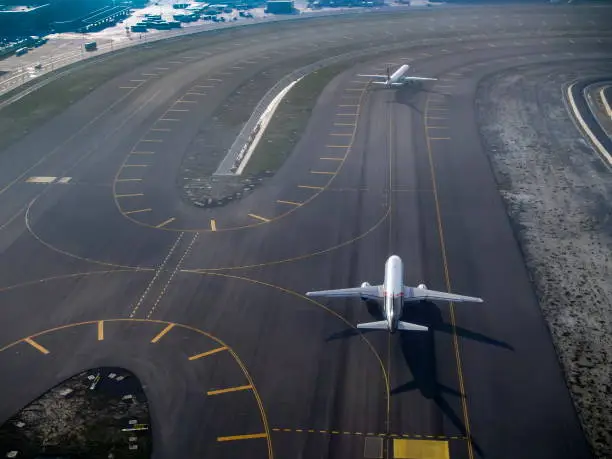 Commercial planes preparing for flight distances from top view on the airport