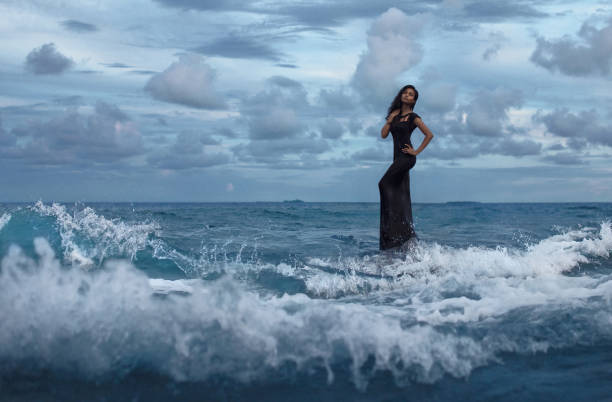 Beautiful woman in the water wave