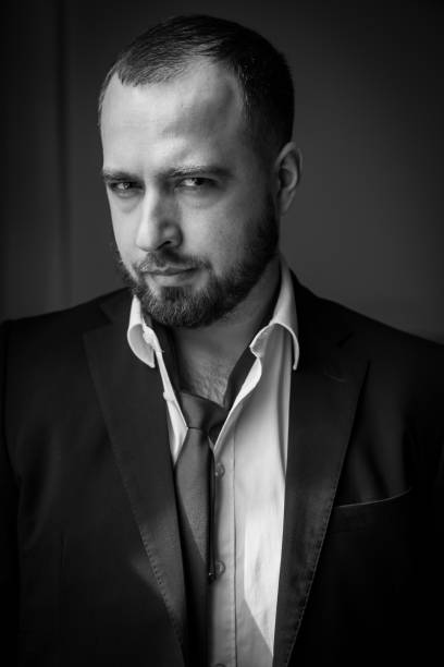 istock portrait of man with beard in suit and tie 1213236024