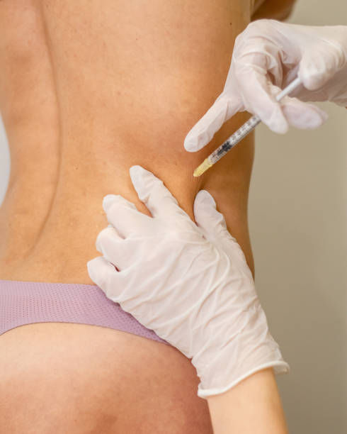 istock Doctor doing Injection into female beautiful body. 1213236317