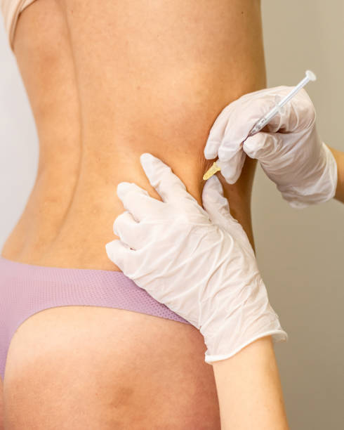 istock Doctor doing Injection into female beautiful body. 1213236473