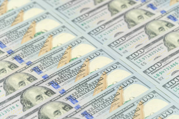 istock Dollars stacked exactly next to each other as a background 1213236513