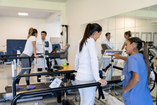 istock Patient walking on the treadmill while exercising in physiotherapy 1213238634
