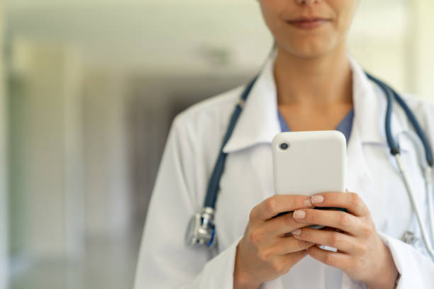 istock Close-up on a doctor using app on a cell phone at the hospital 1213241348