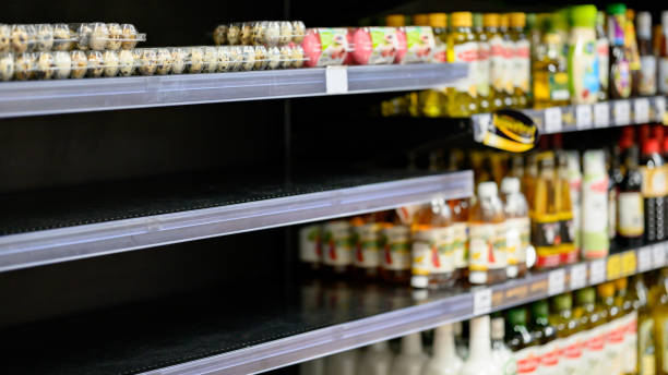 Empty shelves in a grocery store, Hoarding food stock photo