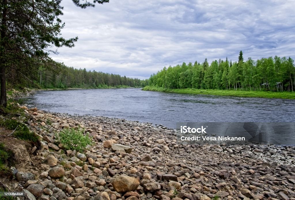 Beautiful river and shore with rocks Nice small river at North of Finland with beautiful scenery. Finland Stock Photo