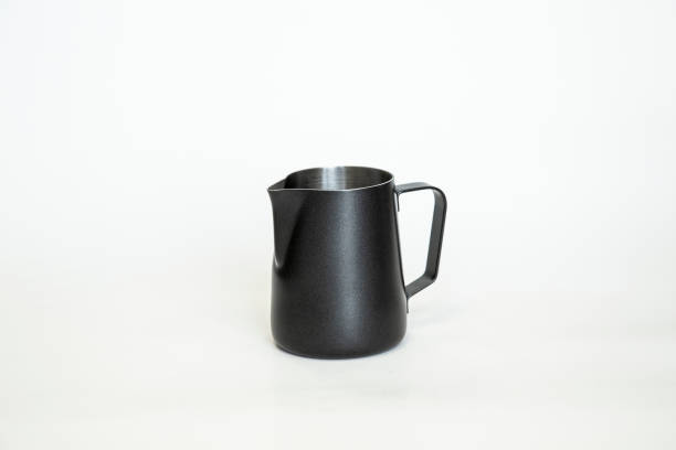istock Black Metal pitcher for coffee making. Barista tool. Milk pitcher. on white background 1213246985
