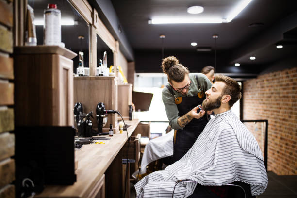 istock Client during beard and moustache grooming in barber shop 1213252309