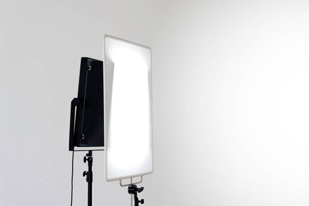 istock Square shaped studio lighting equipment and white fabric filter on grey background. 1213253495