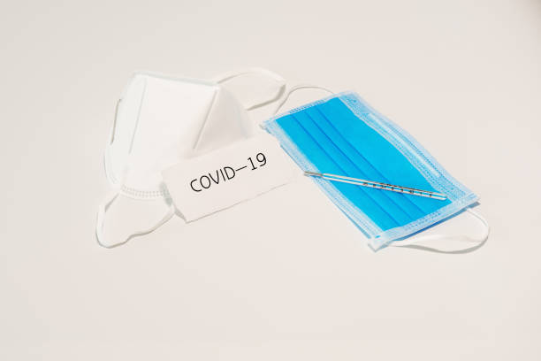 istock Disposable medical mask in white background 1213256847