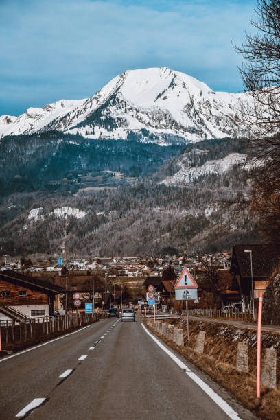 Beautiful Village And Road Near The Alps In Switzerland Beautiful Village And Road Near The Alps In Switzerland jungfrau stock pictures, royalty-free photos & images