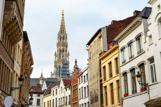 Old town touristic destination with cafes, shops and restaurants in houses of traditional architecture, tower of
