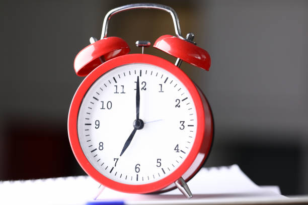 istock Close up table red alarm clock meeting deadlines 1213258703