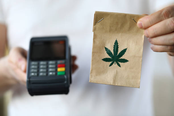 Package delivery with marijuana, payment terminal Package delivery with marijuana, payment terminal. Use and storage medical marijuana. Legalized narcotic herb. Treating pain, stress and insomnia. Registered medical hemp delivery agent cannabis store photos stock pictures, royalty-free photos & images