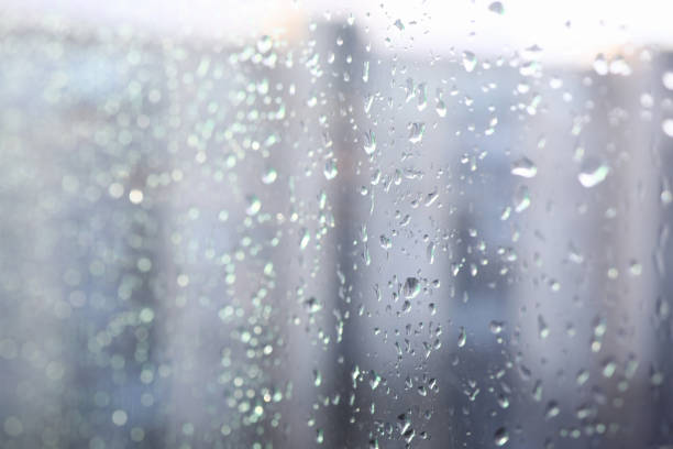 istock Close-up condensate on window, drops on glass 1213258781