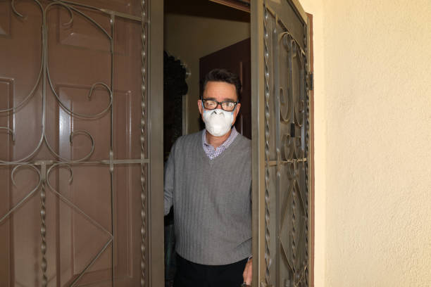 istock Social Distancing Man Opens Door WS 1213259954