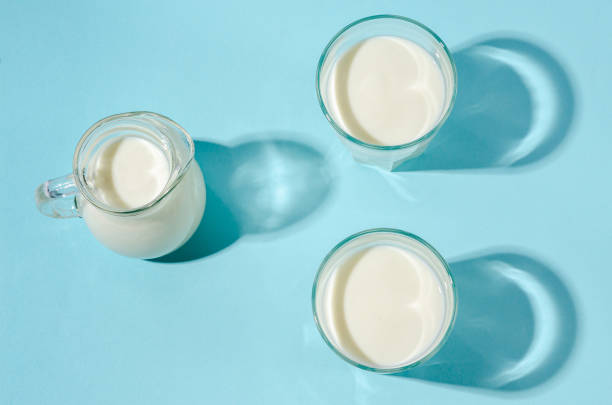 istock Homemade fermented drink - kefir on a blue background, copy space. 1213261910