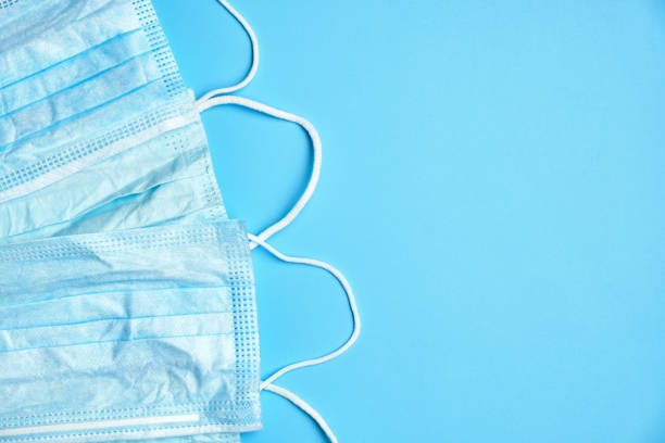 istock Several medical masks on a blue background. top view. copy space 1213262459