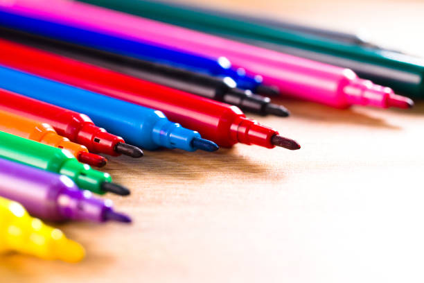 istock multicolored pencils on the wooden table background 1213265413