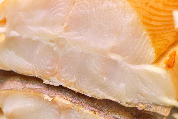 istock Smoked fish in a cut on a store counter. 1213265721