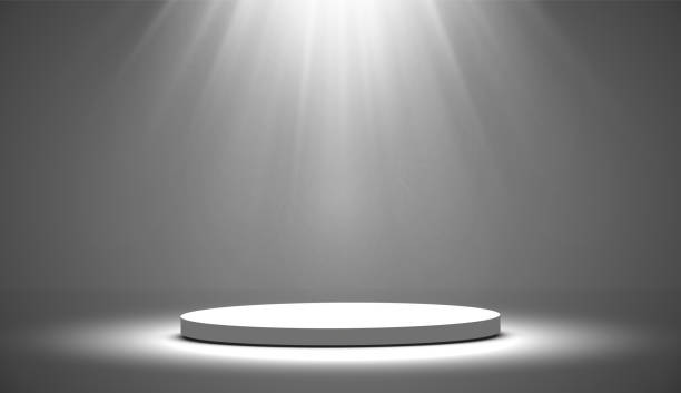istock Round podium, pedestal or platform illuminated by spotlights on white background. Platform for design. Realistic 3D empty podium. Stage with scenic lights 1213265893