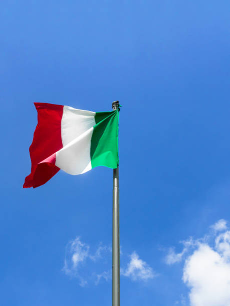 istock Waving Italian flag against blue sky 1213266436