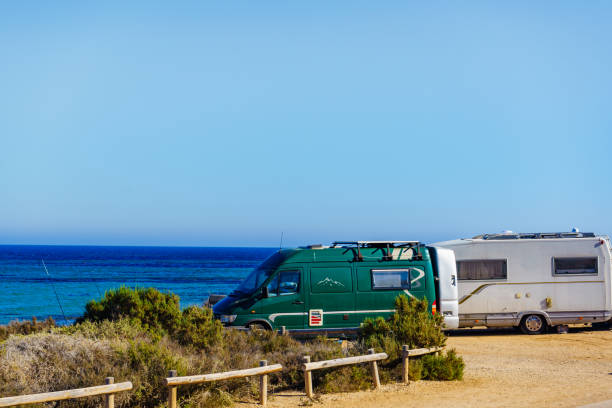istock Camper car on beach, camping on seashore 1213267583