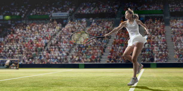 Sportswoman is cheering after winning a tennis  cup on an outdoor stadium full of spectators. She is wearing unbranded sports cloth and using unbranded sport equipment