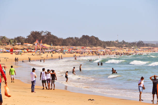 Baga Beach, Goa Goa, India – March 11, 2020: People are enjoying at Baga Beach located close to Calangute beach is one of the most popular, most visited beaches in North Goa, named after the 'Baga creek' which flows into the Arabian Sea. palolem beach stock pictures, royalty-free photos & images