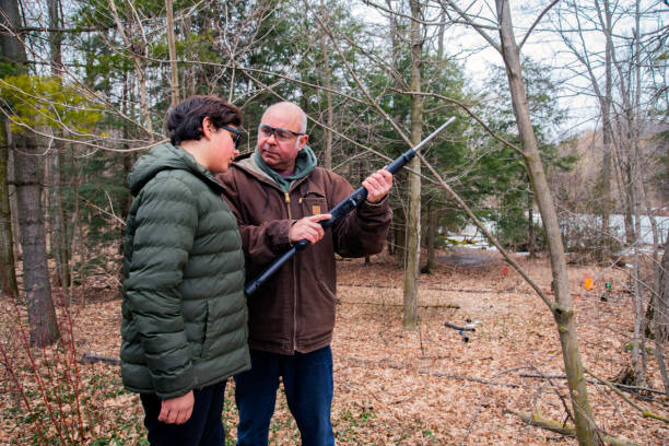 istock A father teaching his son about gun safety 1213271169