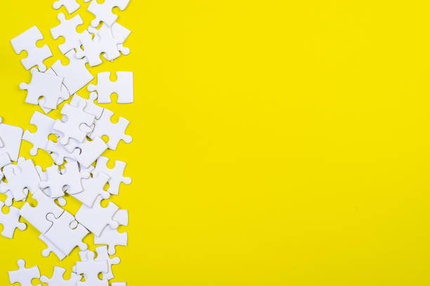 istock Jigsaw puzzles on the yellow background 1213272546