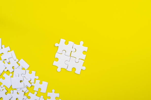 istock Jigsaw puzzles on the yellow background 1213272602