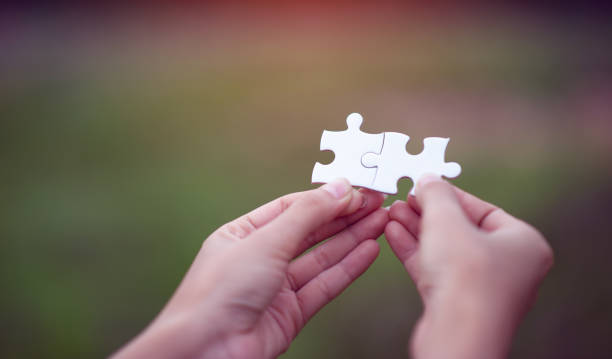 istock Hands and puzzles, important pieces of teamwork Teamwork concept 1213272660