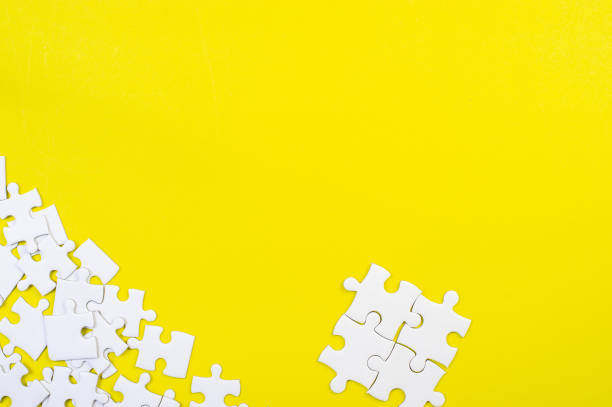 istock Jigsaw puzzles on the yellow background 1213272692