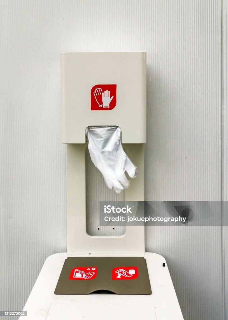 dispenser with one-time plastic gloves for self-protection Box - Container Stock Photo