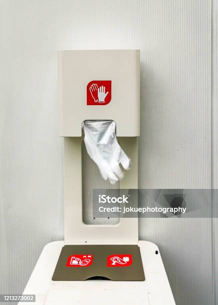 Dispenser With Onetime Plastic Gloves For Selfprotection Stock Photo - Download Image Now