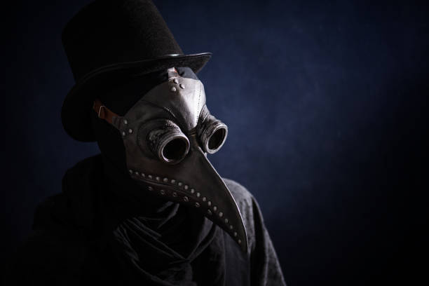 Masked man plague doctor, head profile, with bird mask and hat. Vintage style. Biohazard concept. Masked man plague doctor, head profile, with bird mask and hat. Vintage style. Biohazard concept. epidemic stock pictures, royalty-free photos & images