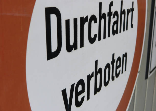 istock Side view on isolated red and white sign passage forbidden (german words: Durchfahrt verboten) - Germany 1213275936