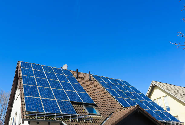 istock View on isolated german roof with solar panels against clear blue sky - Germany 1213275937